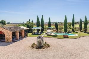 an estate with a swimming pool and a pavilion at Il Podere - Rustic Charm in Tuscany in Monte San Savino