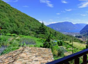 a balcony with a view of a mountain at Casa Furletti Holiday Home in Tenno