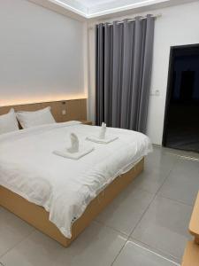 Ένα ή περισσότερα κρεβάτια σε δωμάτιο στο 崇安精品酒店