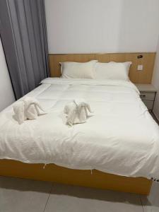 Ένα ή περισσότερα κρεβάτια σε δωμάτιο στο 崇安精品酒店