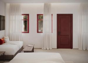 Postel nebo postele na pokoji v ubytování Casa Di Notos Beach Hotel - Georgioupolis