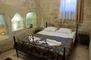 Voodi või voodid majutusasutuse Alaca Cave Cappadocia toas