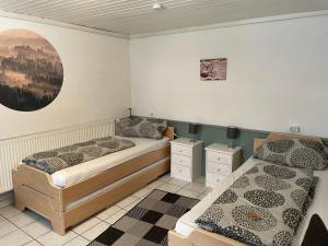 Ένα ή περισσότερα κρεβάτια σε δωμάτιο στο Appartement Wasserfall