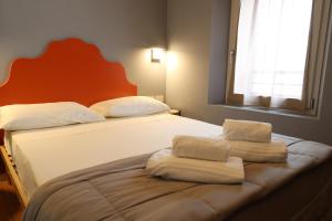 Postel nebo postele na pokoji v ubytování Locanda Lingua