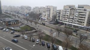 an aerial view of a city with parked cars and buildings at Apartament modern 3 camere ultracentral McDonalds Orange in Craiova
