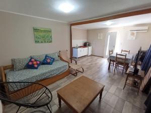 a living room with a couch and a table at Casa Quinta en Victoria in Victoria