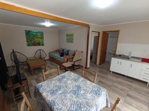a living room with a bed and a table at Casa Quinta en Victoria in Victoria +22 photos