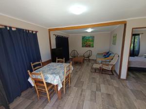 a living room with a table and chairs at Casa Quinta en Victoria in Victoria