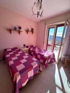 En eller flere senge i et værelse på Il Terrazzo di Anna + 1 billede