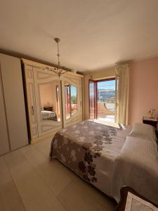 En eller flere senge i et værelse på Il Terrazzo di Anna