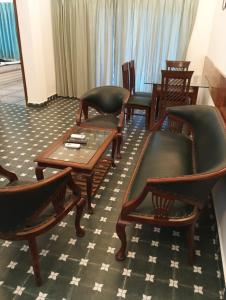 a group of chairs and tables in a room at Sana Villas Anjuna Beach Goa "Premium Luxury Villa with Pool" in Anjuna +105 photos