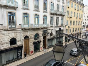 a view of a city street with buildings at A cozy hideout in Lisbon