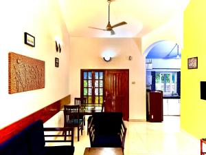 a dining room with a table and chairs at Sana Villas Anjuna Beach Goa "Premium Luxury Villa with Pool" in Anjuna
