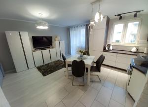 TV a/nebo společenská místnost v ubytování Apartament Barbara