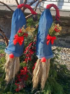 a pair of christmas ornaments hanging on a tree at Guesthouse Aelia in Kato Loutraki