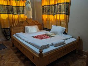 Giường trong phòng chung tại Bethlehem Lodge