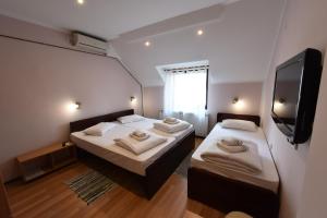 Postel nebo postele na pokoji v ubytování Apartments & Accommodation Stojic