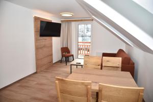 TV a/nebo společenská místnost v ubytování Katschbergstub'n