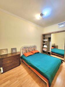 Postel nebo postele na pokoji v ubytování Rustaveli Grand Stay