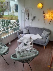 a living room with a couch and a table at Appartment with Spa in Vienna