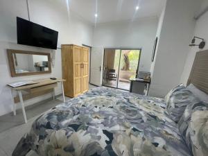 Ένα ή περισσότερα κρεβάτια σε δωμάτιο στο The Rest Self Catering +14 φωτογραφίες