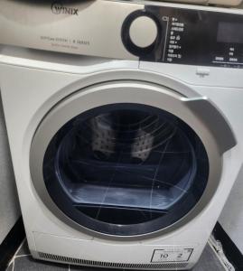 a washing machine with a cat inside of it at Hanok Story in Jeonju