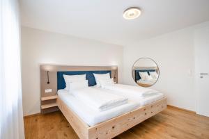 Postel nebo postele na pokoji v ubytování SEEZEIT Residence