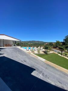 an empty road next to a swimming pool at Chalé da Boucinha in Celorico de Basto