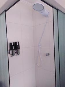 Et badeværelse på Marinhos Apartment - Guarujá