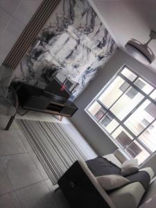 Et opholdsområde på Marinhos Apartment - Guarujá