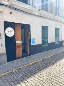 a building with a sign on the side of it at SEVILLE YOUR WAY in Seville +61 photos