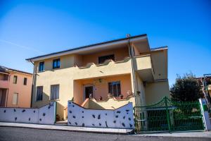 a house with a fence in front of it at affittacamere S'Ortensia in Mamoiada