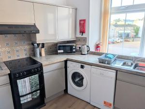 Køkken eller tekøkken på Longrow Apartment