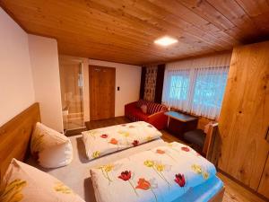 Ένα ή περισσότερα κρεβάτια σε δωμάτιο στο Ferienhaus Beate