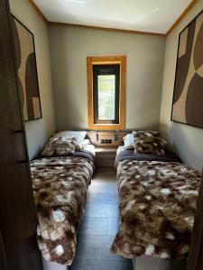 En eller flere senge i et værelse på Austria Parks - Camping Arlberg GmbH