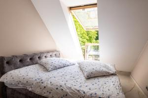 En eller flere senge i et værelse på Haus Saxonia