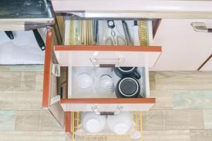an open cabinet with aartments at Oharama House in Nasushiobara