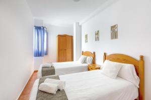 Postel nebo postele na pokoji v ubytování Brisa Marina amplio y luminoso con vistas al mar