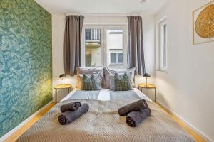 En eller flere senge i et værelse på Apartment Botanika 2