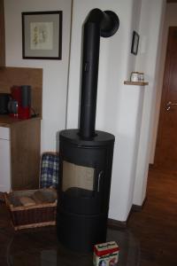 a black stove sitting on a table in a room at Landhaus Andreus 