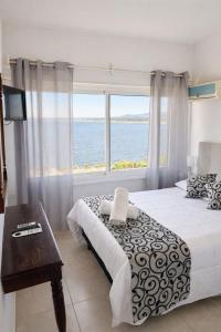 Postel nebo postele na pokoji v ubytování SAN ANTONIO