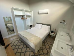 En eller flere senge i et værelse på Carpe diem Boutique e spa + 16 billeder