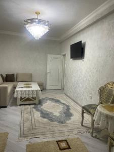 Et tv og/eller underholdning på Апартамент с 3 комнатами