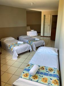 Postel nebo postele na pokoji v ubytování Hotel Mamoan