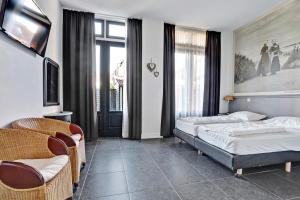 Postel nebo postele na pokoji v ubytování Residence Wijngaerde - Baddomburg