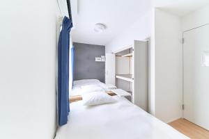 Postel nebo postele na pokoji v ubytování 2025年12月オープンセール 大阪駅まで一駅 フルリノベーション 長期割引有り 最大8人