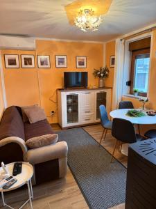 a living room with a couch and a table at Noel in Vukovar