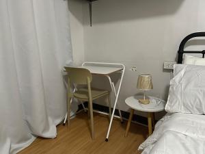 En eller flere senge i et værelse på Rais Place