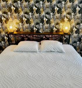 En eller flere senge i et værelse på Appartement T2 avec SAUNA privatif + 2 billeder