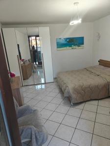 Giường trong phòng chung tại Bilocale vacanze